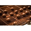Hazelnuts getting their second rich layer of chocolate - building that perfect, glossy finish. 