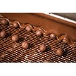 Hazelnuts getting their second rich layer of chocolate - building that perfect, glossy finish. 